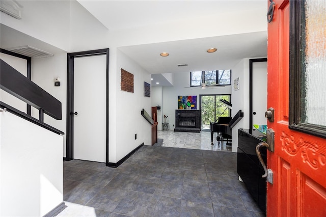 entrance foyer featuring recessed lighting, visible vents, a fireplace, and a ceiling fan