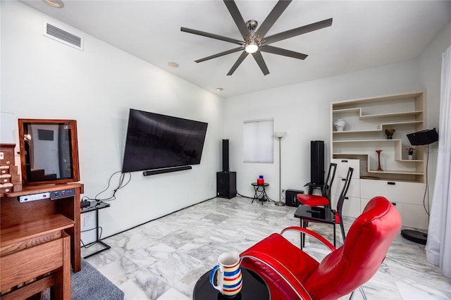 living room featuring visible vents, marble finish floor, and ceiling fan