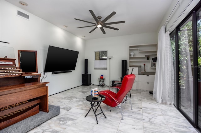 living room with visible vents, marble finish floor, and ceiling fan