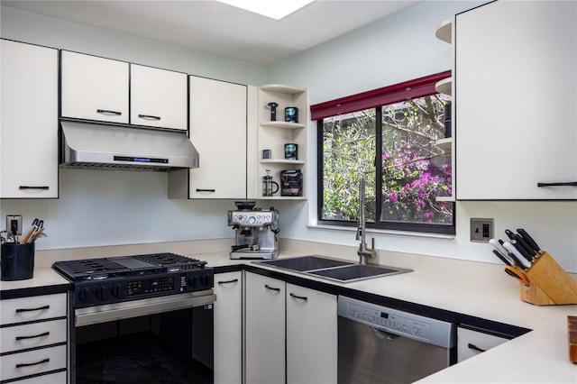 kitchen featuring range with gas stovetop, a sink, white cabinets, under cabinet range hood, and dishwasher