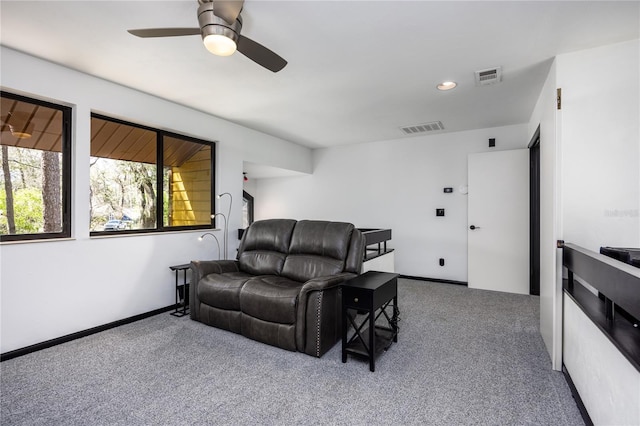 carpeted living room featuring recessed lighting, a ceiling fan, visible vents, and baseboards