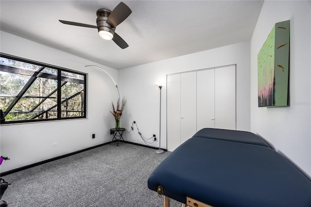 carpeted bedroom featuring a closet, ceiling fan, and baseboards