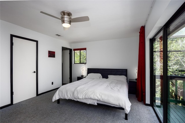 bedroom with carpet flooring, visible vents, and ceiling fan