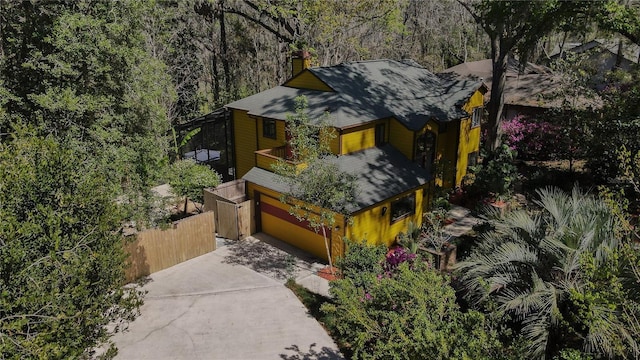 drone / aerial view featuring a view of trees