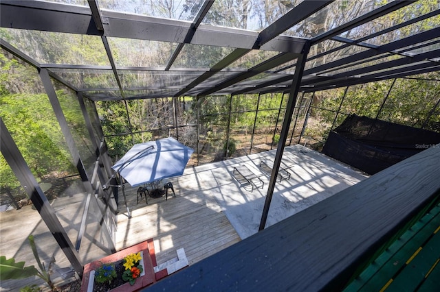 deck with glass enclosure and outdoor dining space