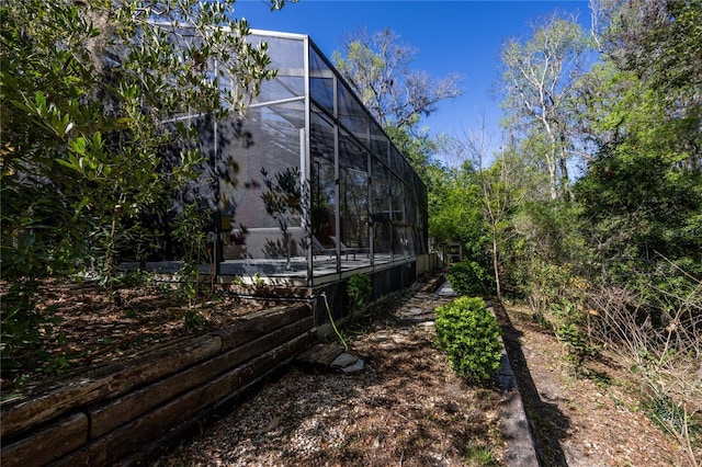 view of yard featuring a lanai