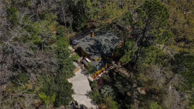 drone / aerial view featuring a view of trees