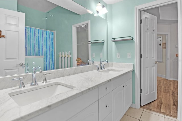 1132 SW 105th Ter, Gainesville, FL 32607 - bathroom with double vanity, tile patterned floors, baseboards, and curtained shower