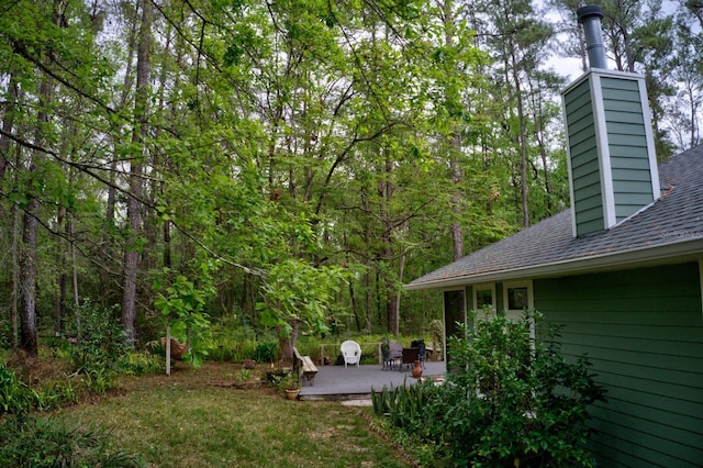 1132 SW 105th Ter, Gainesville, FL 32607 - view of yard with a patio area and a wooded view