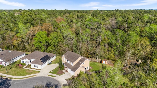 aerial view featuring a wooded view