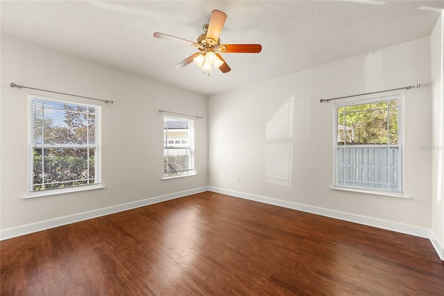 unfurnished room featuring wood finished floors, baseboards, and ceiling fan