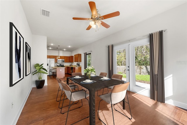 dining area with wood finished floors, baseboards, visible vents, recessed lighting, and ceiling fan