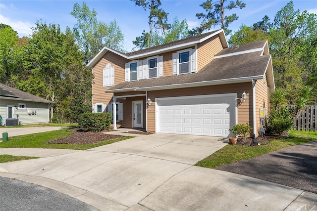 view of front of home with a garage, cooling unit, concrete driveway, and fence