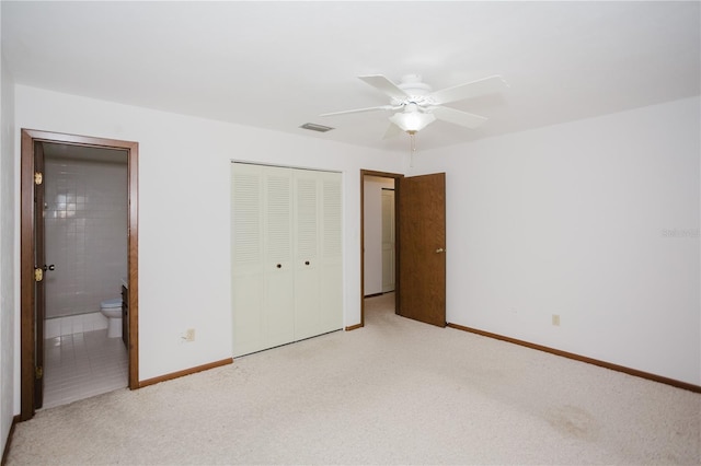 unfurnished bedroom with visible vents, baseboards, carpet, ensuite bathroom, and a closet