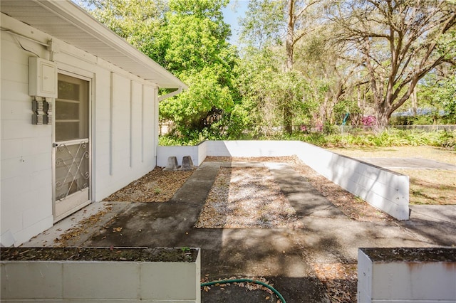 view of patio featuring fence