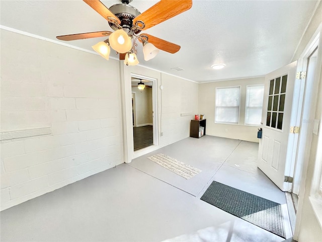 interior space featuring a ceiling fan