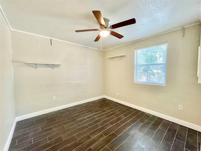 empty room with wood finish floors, baseboards, ceiling fan, and ornamental molding