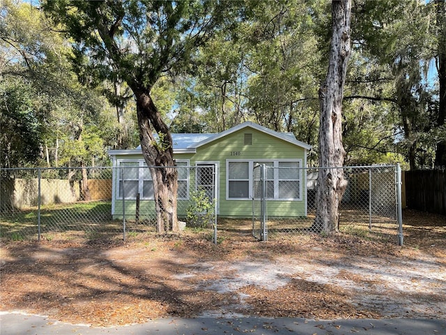 view of front of property featuring fence