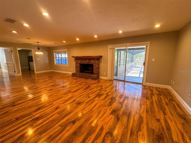 460 SE 4th Ave, Melrose, FL 32666 - unfurnished living room with baseboards, recessed lighting, a fireplace, and dark wood finished floors