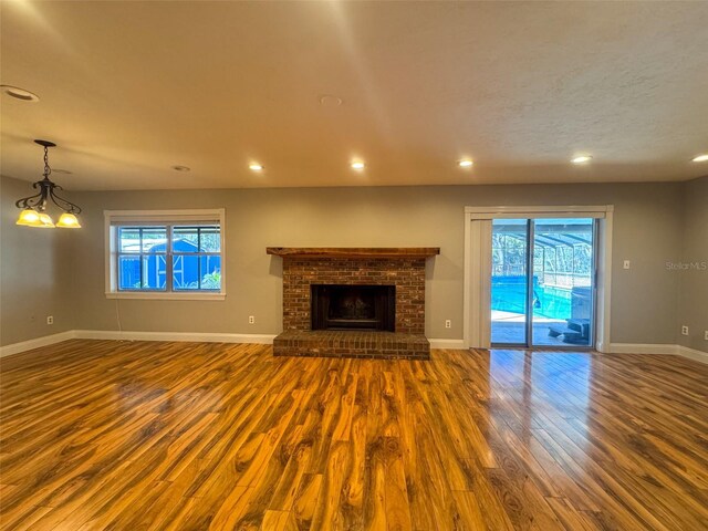 460 SE 4th Ave, Melrose, FL 32666 - unfurnished living room featuring a wealth of natural light, recessed lighting, baseboards, and wood finished floors