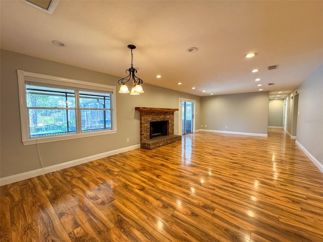 460 SE 4th Ave, Melrose, FL 32666 - unfurnished living room with recessed lighting, visible vents, baseboards, and wood finished floors