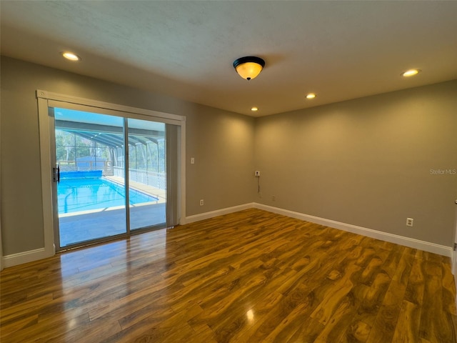 460 SE 4th Ave, Melrose, FL 32666 - empty room with baseboards, dark wood-style floors, and recessed lighting