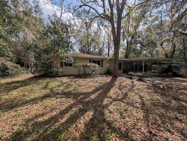 rear view of house with a carport