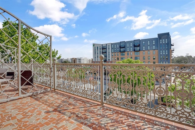 view of gate with a city view