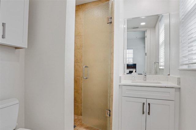 full bath featuring a shower stall, toilet, and vanity