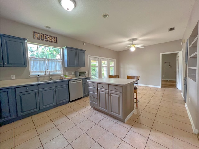 kitchen featuring visible vents, light tile patterned flooring, a sink, light countertops, and dishwasher