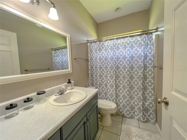 bathroom with vanity, tile patterned floors, toilet, and a shower with curtain