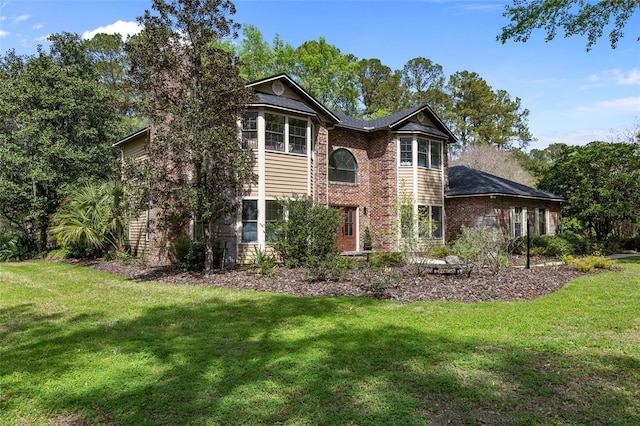 1118 SW 112th St, Gainesville, FL 32607 - view of front of home with a front yard and brick siding