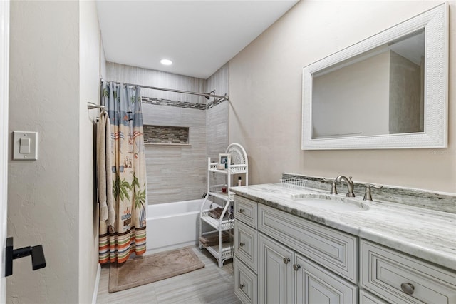 1118 SW 112th St, Gainesville, FL 32607 - full bathroom featuring shower / bath combination with curtain, vanity, and a textured wall
