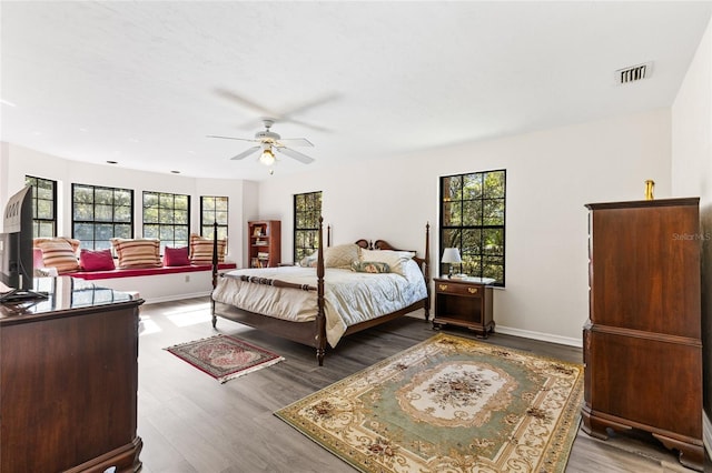 1118 SW 112th St, Gainesville, FL 32607 - bedroom with ceiling fan, visible vents, baseboards, and wood finished floors