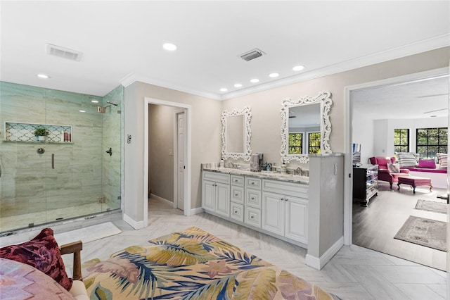 1118 SW 112th St, Gainesville, FL 32607 - ensuite bathroom featuring visible vents, a shower stall, crown molding, double vanity, and baseboards