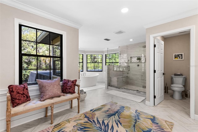 1118 SW 112th St, Gainesville, FL 32607 - full bathroom with visible vents, toilet, ornamental molding, a stall shower, and a freestanding tub