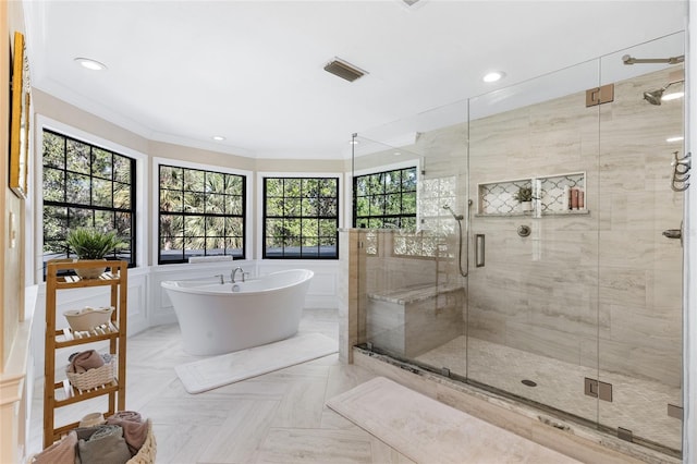 1118 SW 112th St, Gainesville, FL 32607 - full bath featuring a freestanding tub, visible vents, a stall shower, recessed lighting, and crown molding
