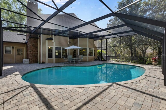 1118 SW 112th St, Gainesville, FL 32607 - pool with a patio area and glass enclosure