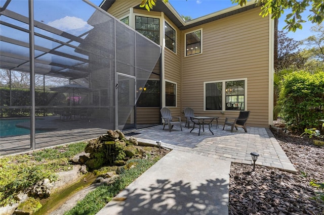 1118 SW 112th St, Gainesville, FL 32607 - view of patio featuring a lanai and an outdoor pool
