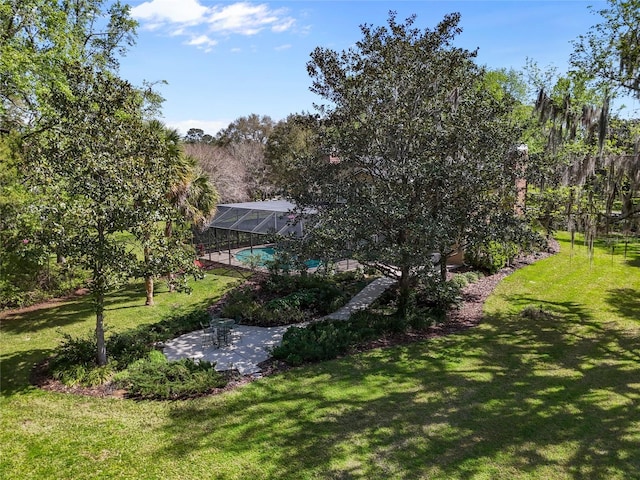 1118 SW 112th St, Gainesville, FL 32607 - view of yard with an outdoor pool, glass enclosure, and a patio area