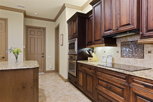 kitchen with light stone countertops, visible vents, appliances with stainless steel finishes, and ornamental molding