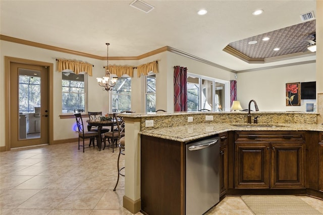kitchen featuring a sink, visible vents, stainless steel dishwasher, and ornamental molding