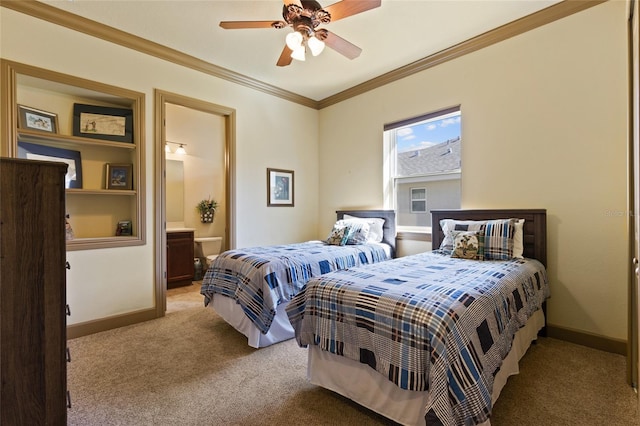 bedroom with ensuite bath, crown molding, baseboards, and light carpet