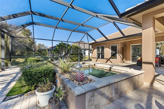 view of pool with a lanai and a patio area