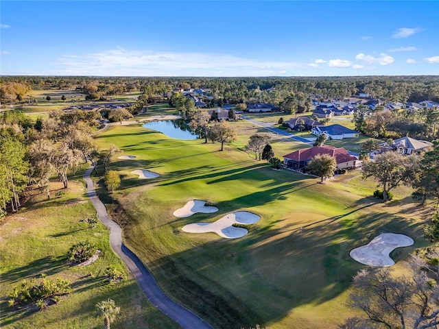 birds eye view of property featuring a water view and golf course view
