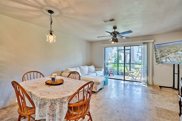 2635 SW 35th Pl Unit 2006, Gainesville, FL 32608 - dining room with plenty of natural light, baseboards, and ceiling fan