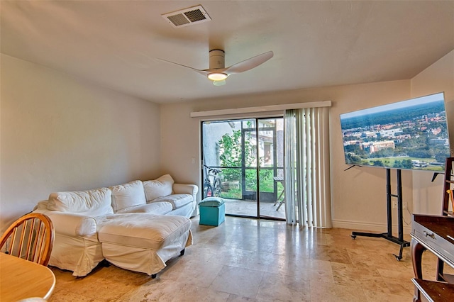 2635 SW 35th Pl Unit 2006, Gainesville, FL 32608 - living room with a ceiling fan and baseboards