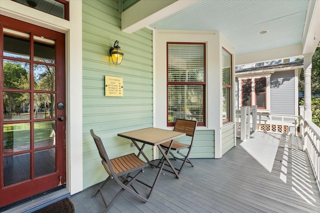 wooden terrace with a porch