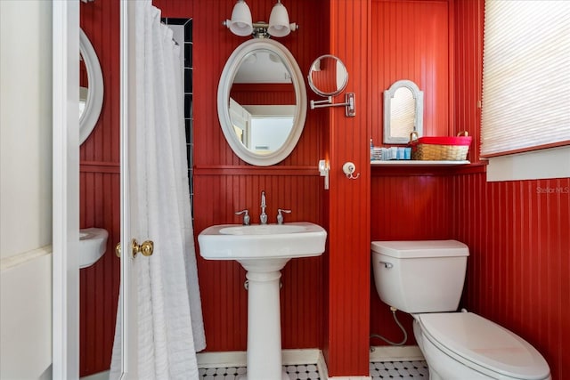 bathroom featuring toilet and a sink
