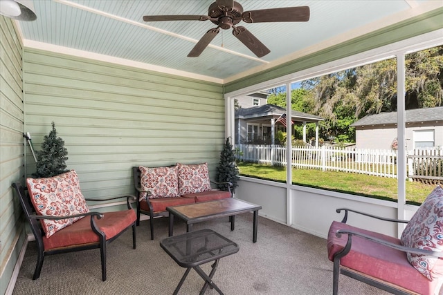 sunroom with an outdoor living space and a ceiling fan